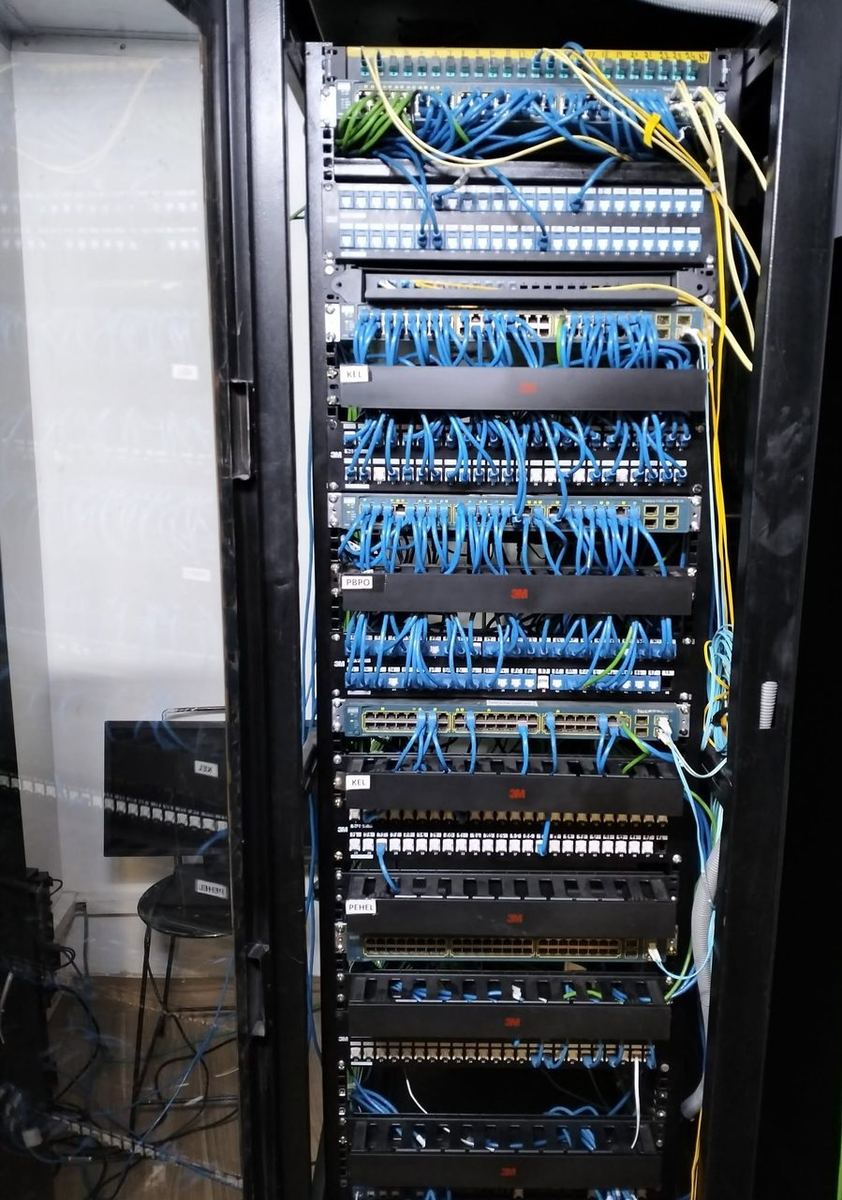 Enterprise network rack with structured cabling and managed switches installed by RITE Solutions